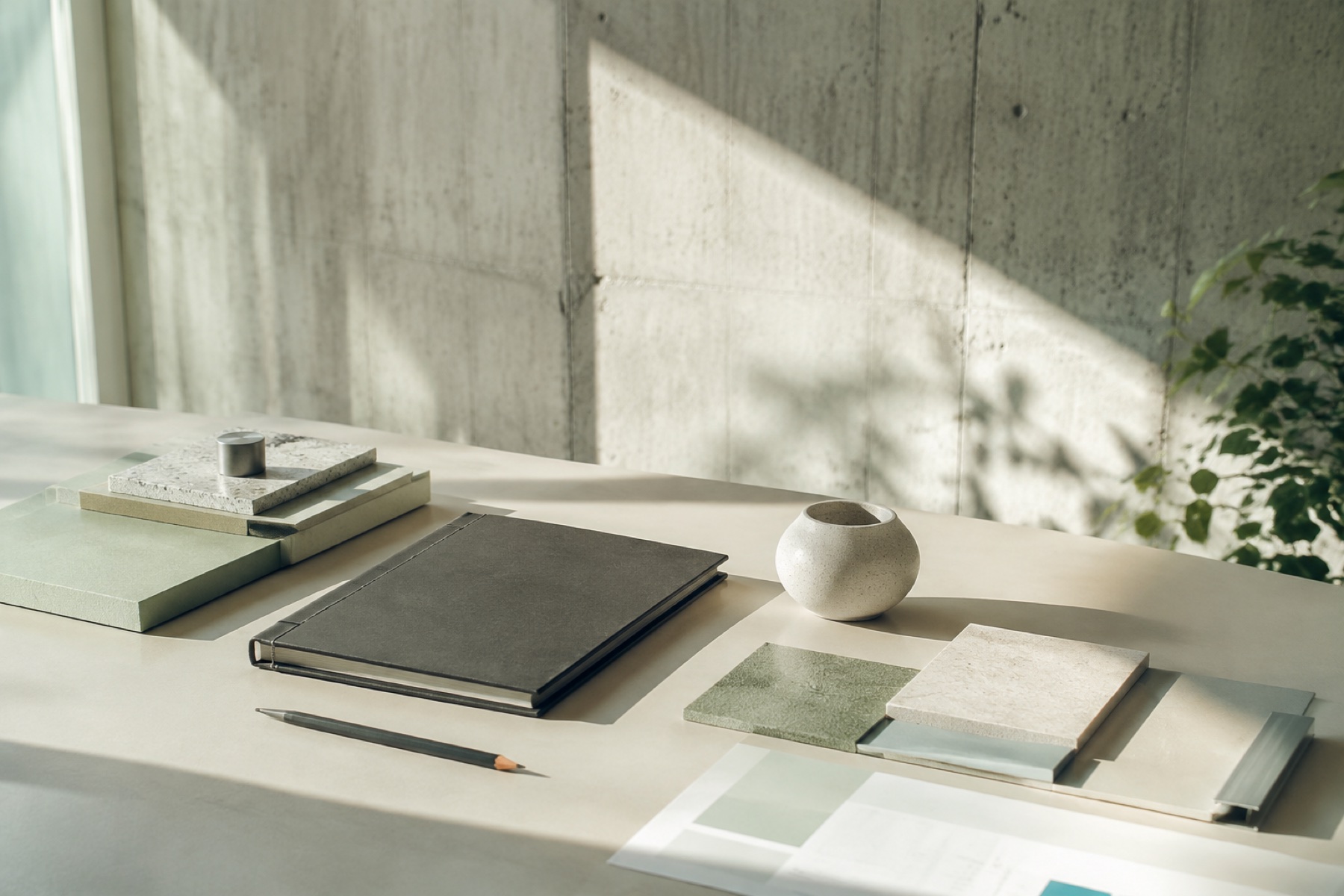 A calm design studio desk with material samples